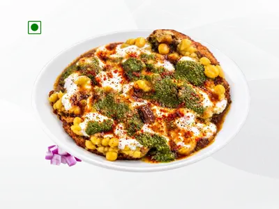flavorful 175g serving of crispy golden fried potato cubes tossed in tangy tamarind chutney, green mint chutney, and spices by Wheeler's Food.